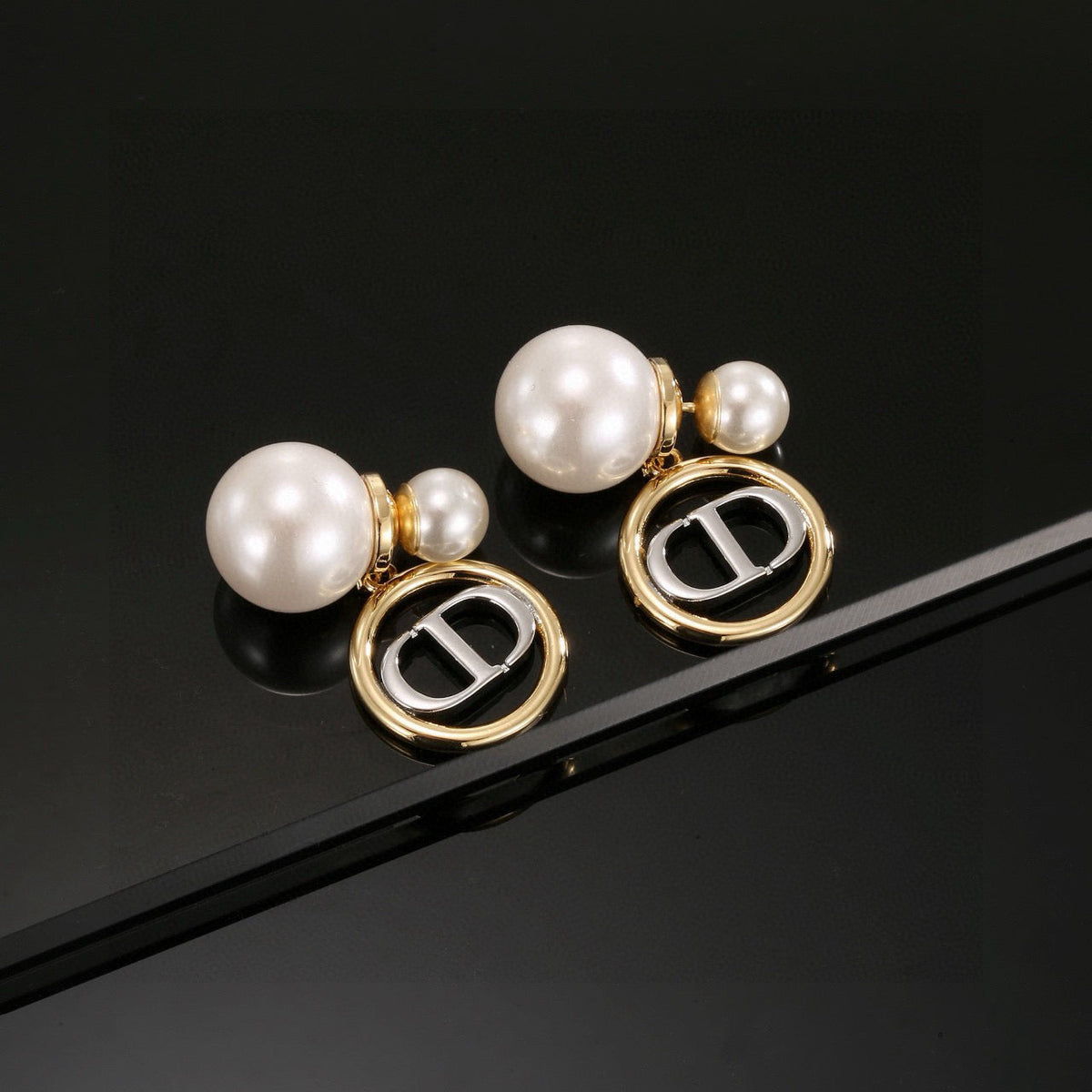 Martin Graham stud earrings in polished metal-tone – front view