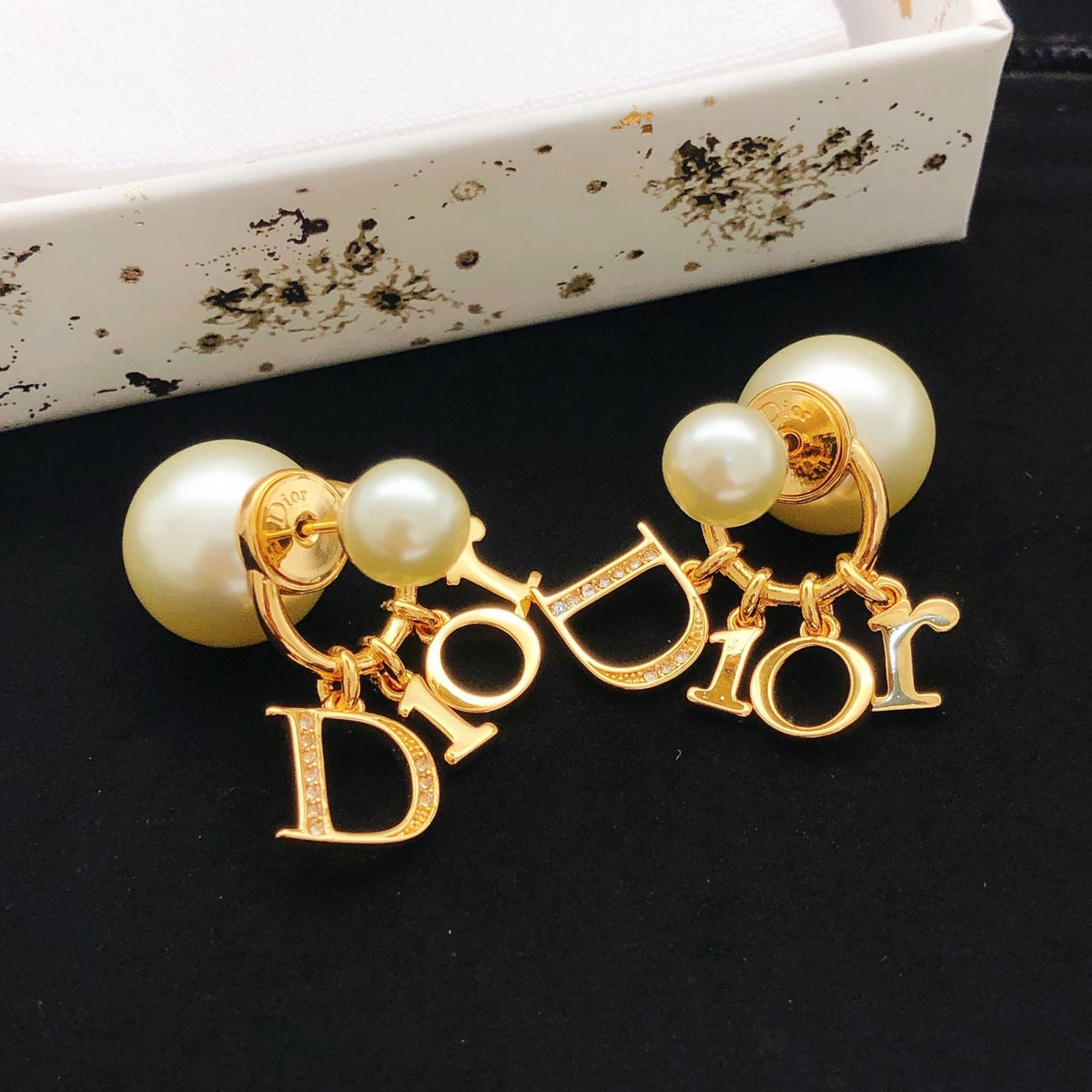 Martin Graham stud earrings in polished metal-tone – front view