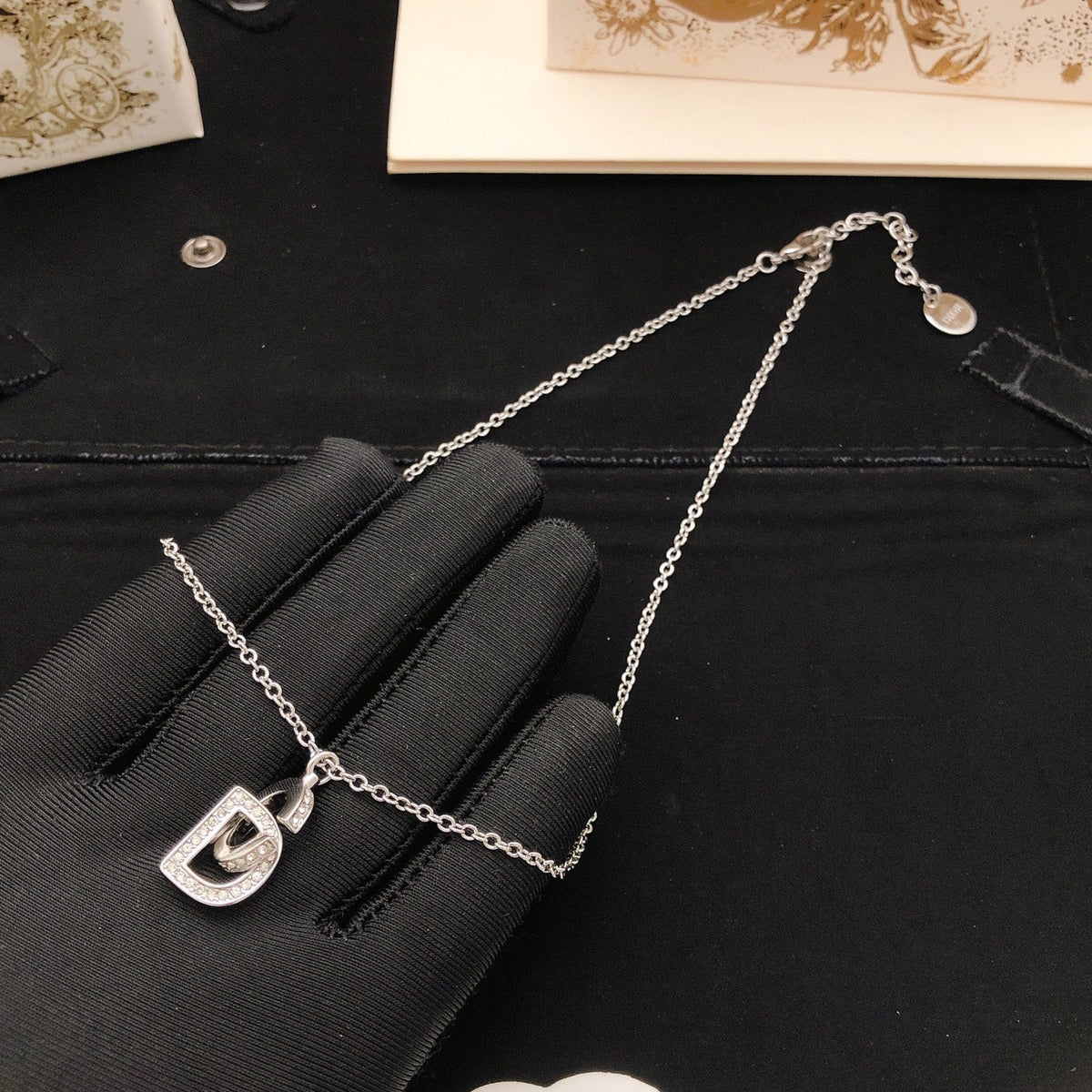 Martin Graham pendant necklace in polished metal-tone – front view