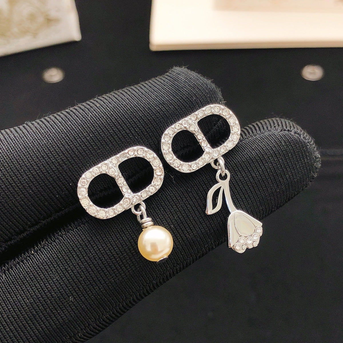 Martin Graham stud earrings in polished metal-tone – front view