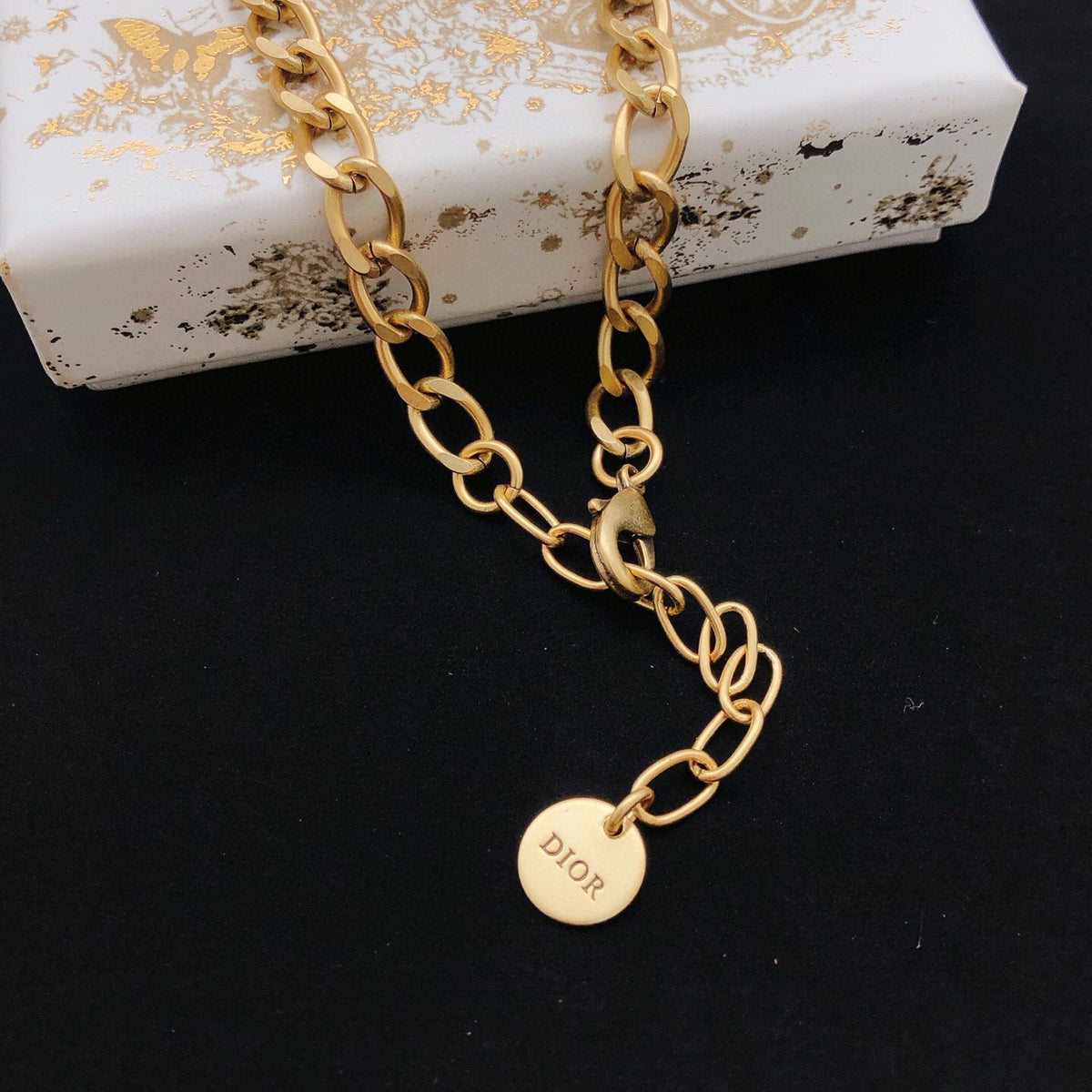 Martin Graham pendant necklace in polished metal-tone – front view