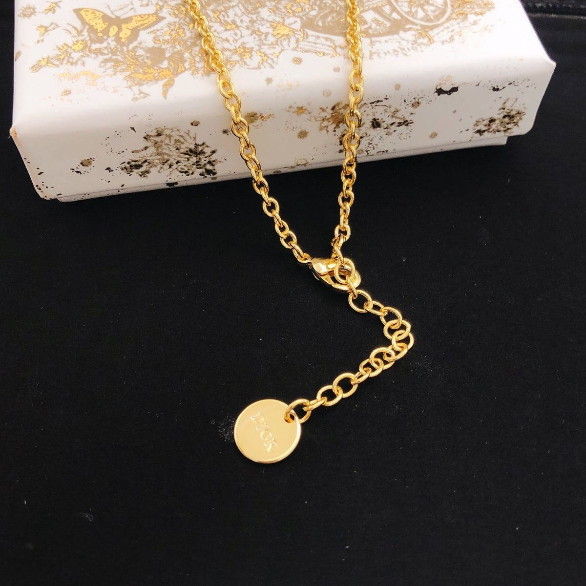 Martin Graham pendant necklace in polished metal-tone – front view