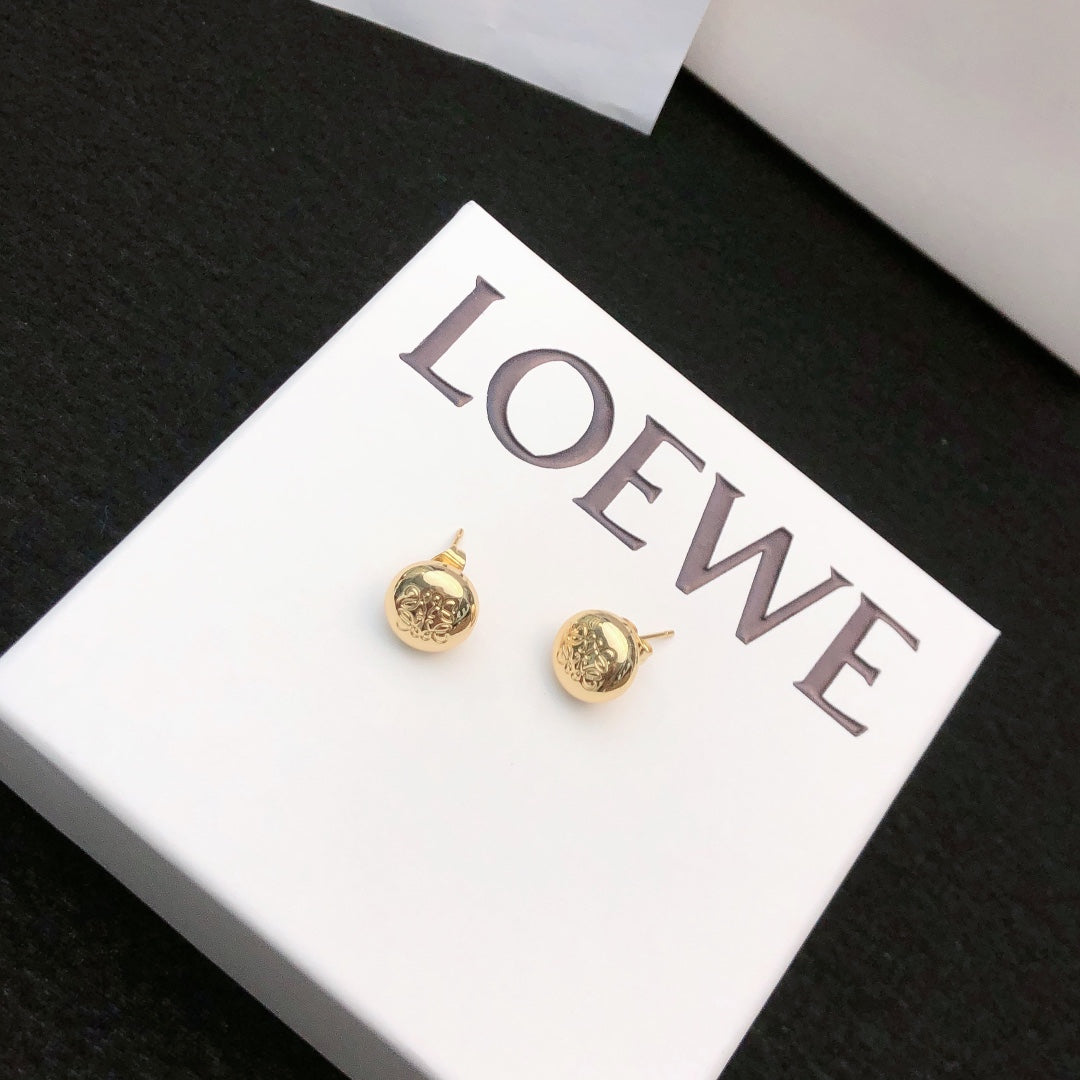 Martin Graham stud earrings in polished metal-tone – front view