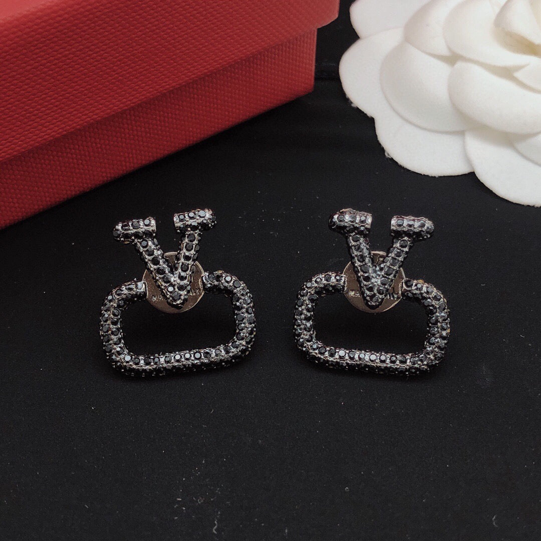 Martin Graham stud earrings in polished metal-tone – front view