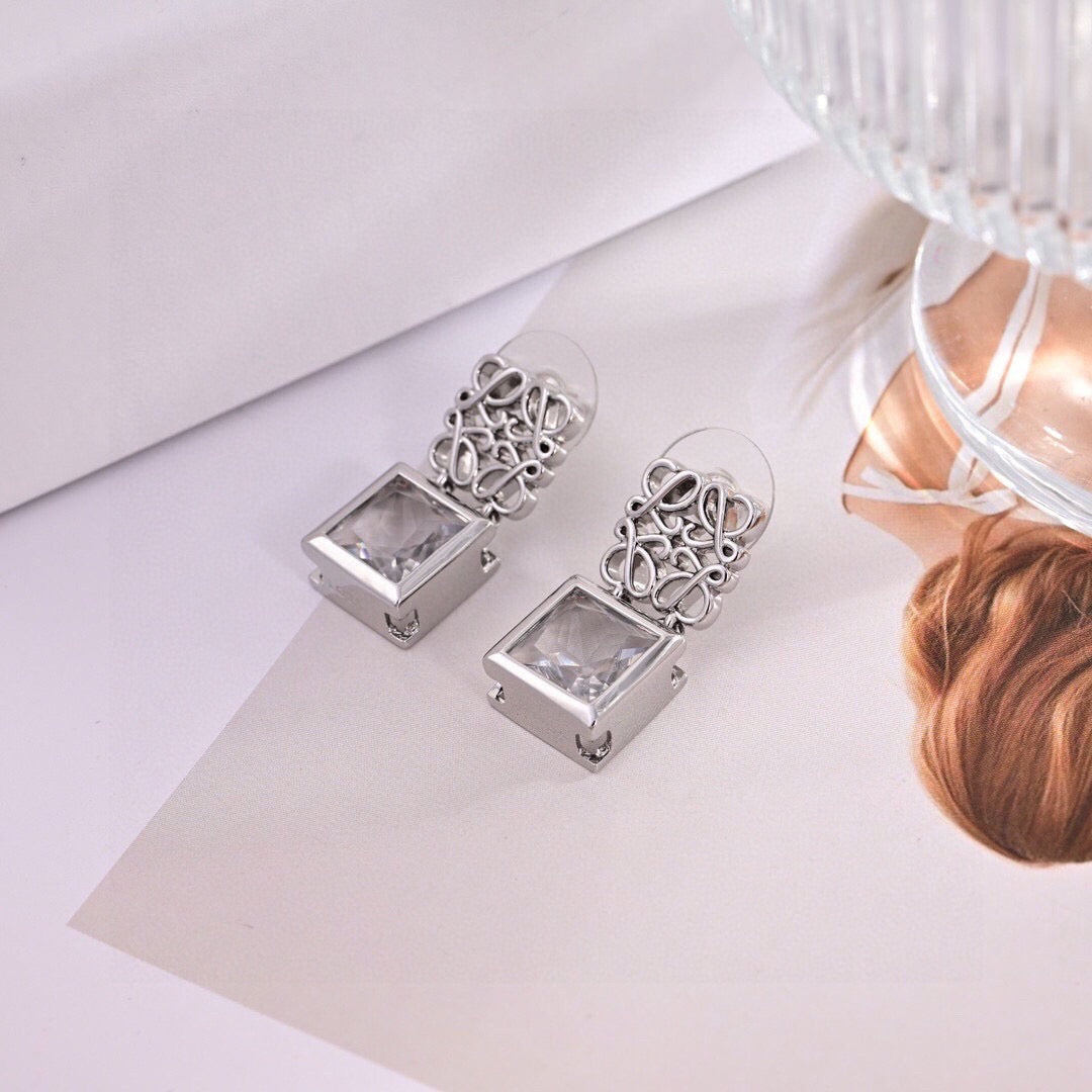 Martin Graham stud earrings in polished metal-tone – front view