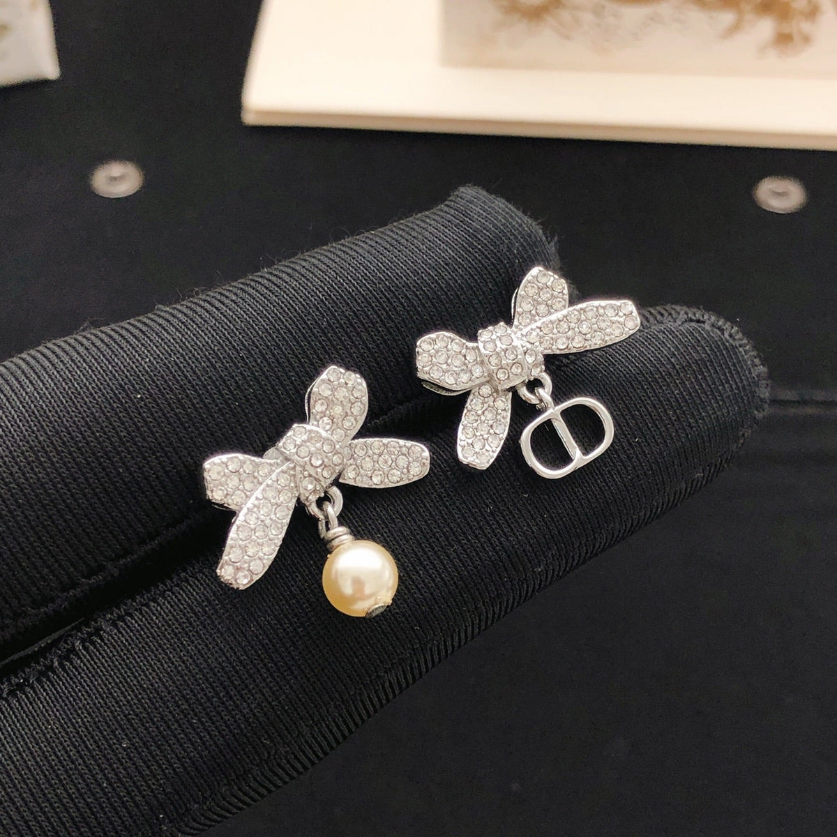 Martin Graham stud earrings in polished metal-tone – front view