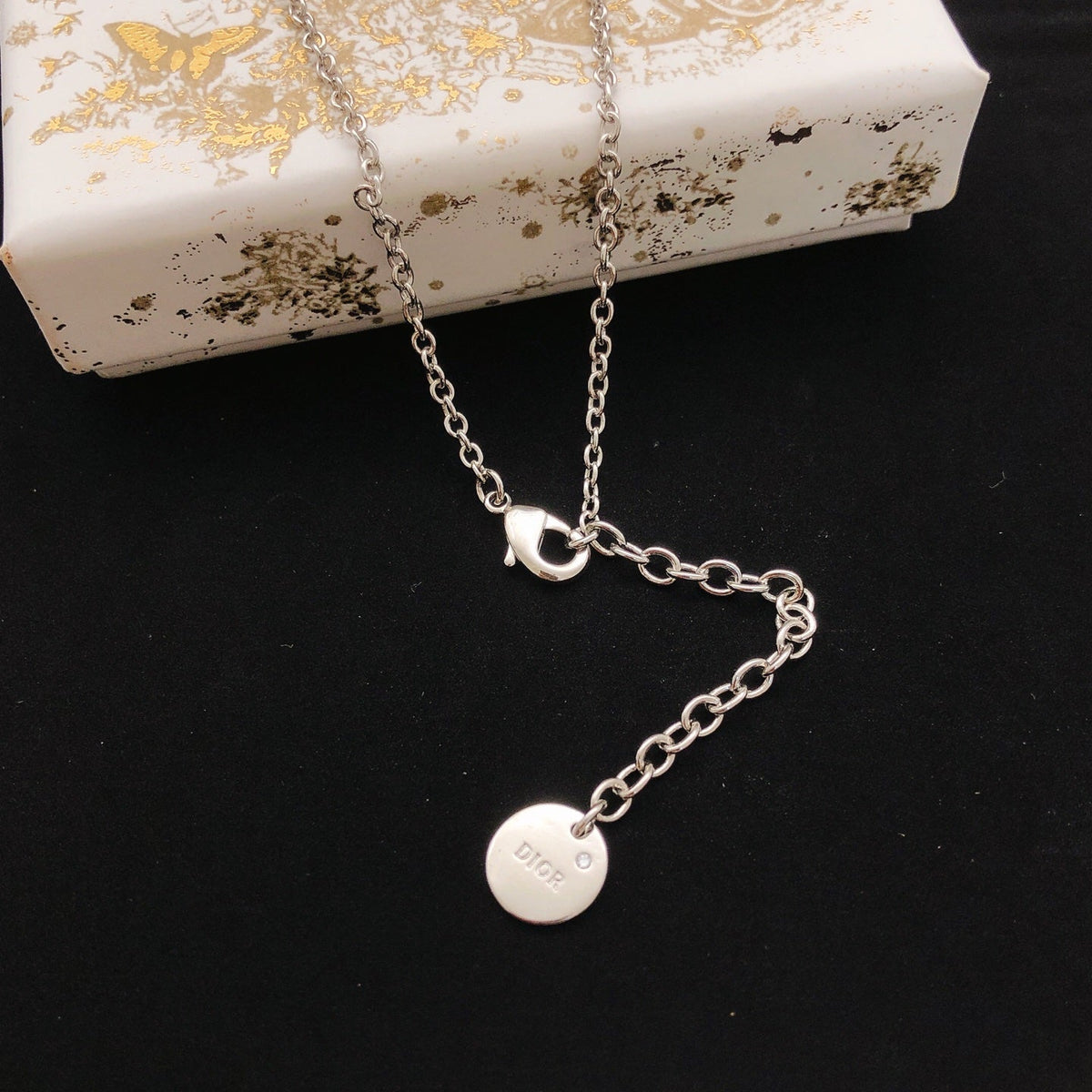 Martin Graham pendant necklace in polished metal-tone – front view