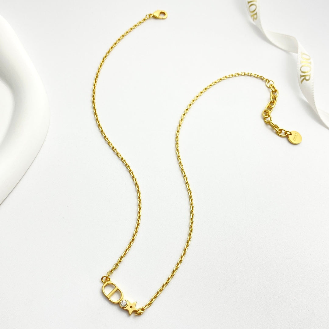 Martin Graham pendant necklace in polished metal-tone – front view