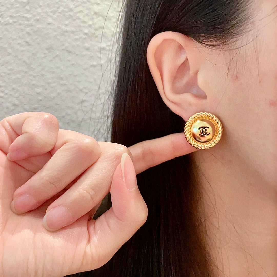 Martin Graham stud earrings in polished metal-tone – front product view