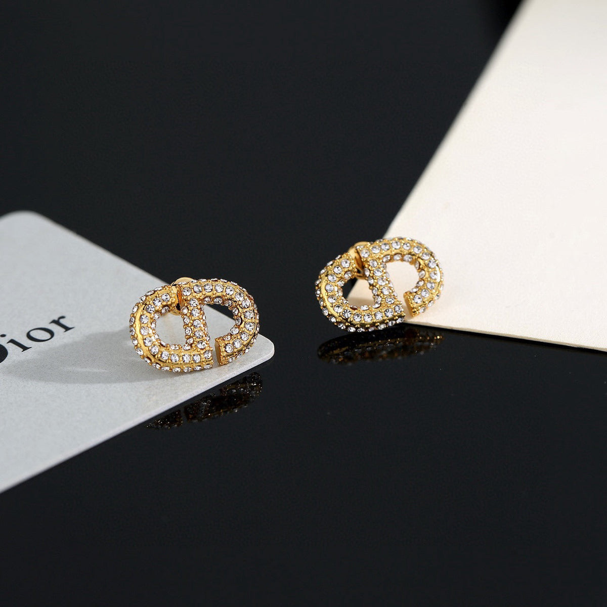 Martin Graham stud earrings in polished metal-tone – front view