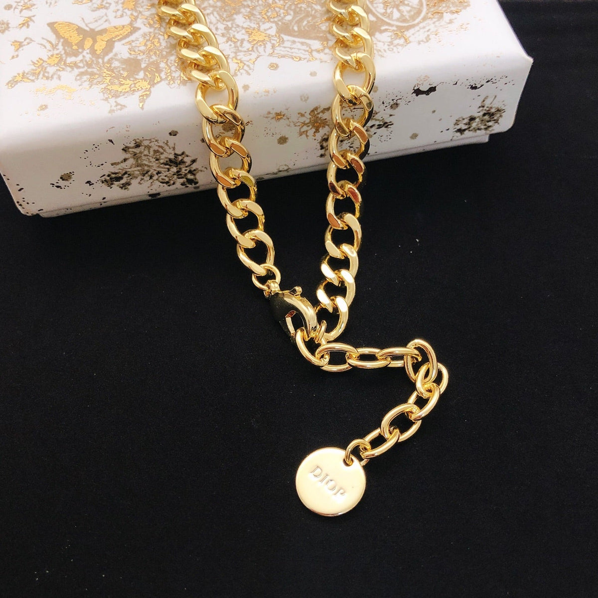 Martin Graham pendant necklace in polished metal-tone – front view