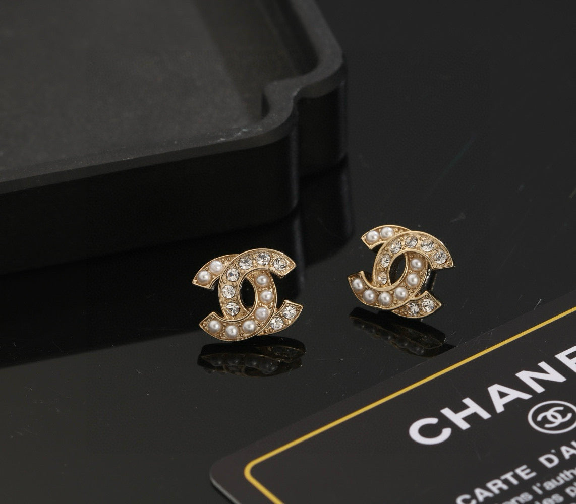 Martin Graham stud earrings in polished metal-tone – front product view