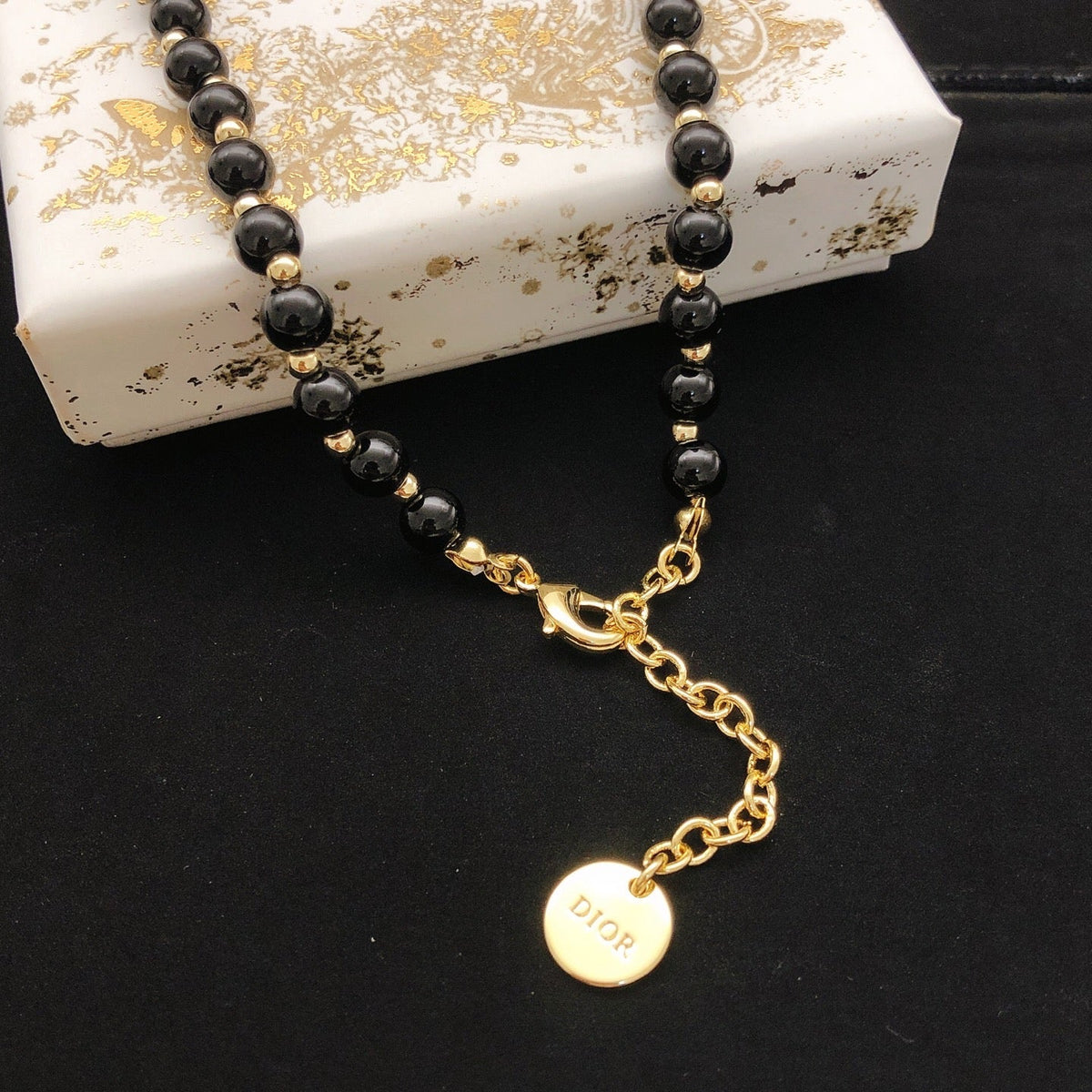 Martin Graham pendant necklace in polished metal-tone – front view