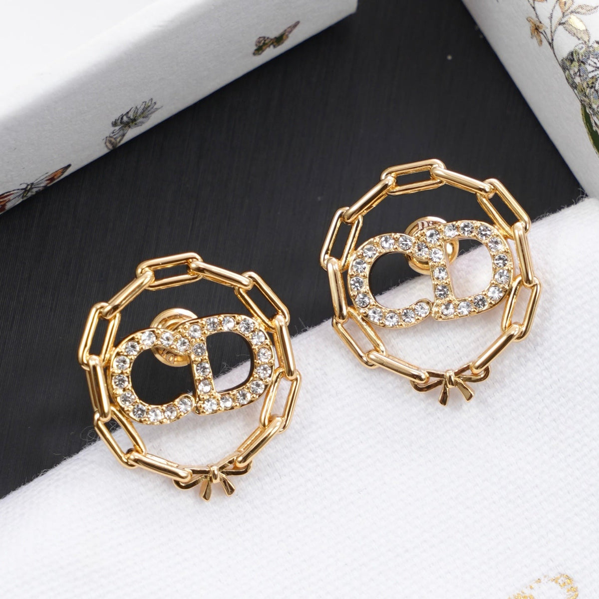 Martin Graham stud earrings in polished metal-tone – front view