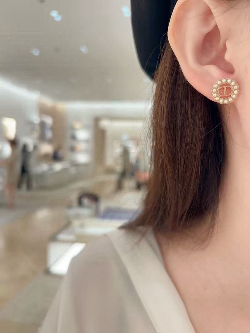 Martin Graham stud earrings in polished metal-tone – front view