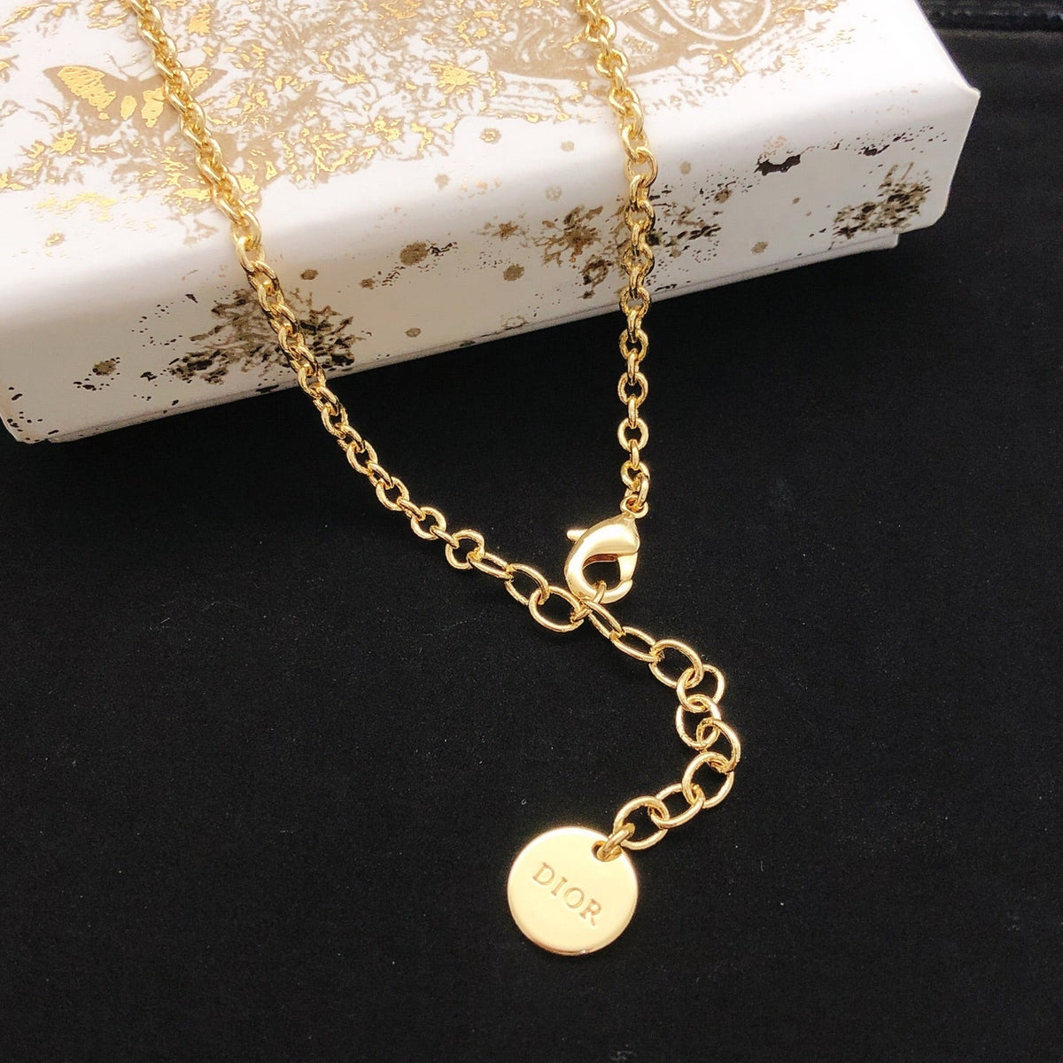 Martin Graham pendant necklace in polished metal-tone – front view