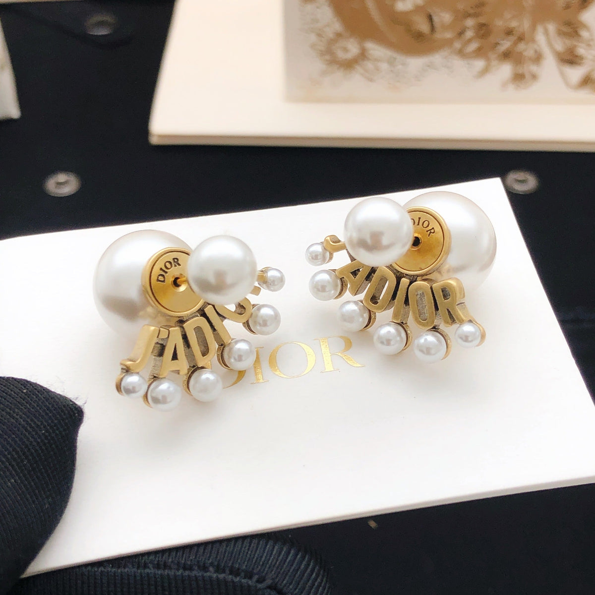 Martin Graham stud earrings in polished metal-tone – front view