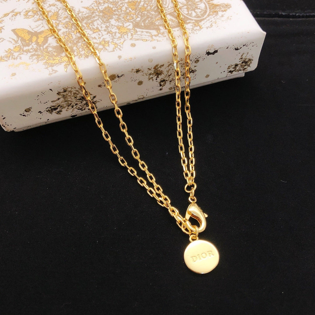 Martin Graham pendant necklace in polished metal-tone – front view