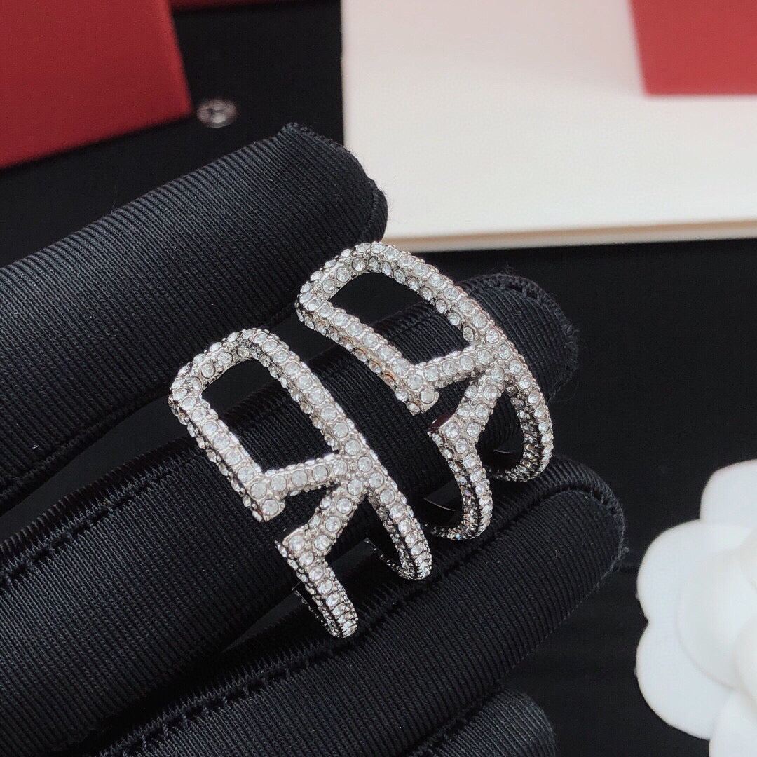 Martin Graham earrings in polished metal-tone – front view