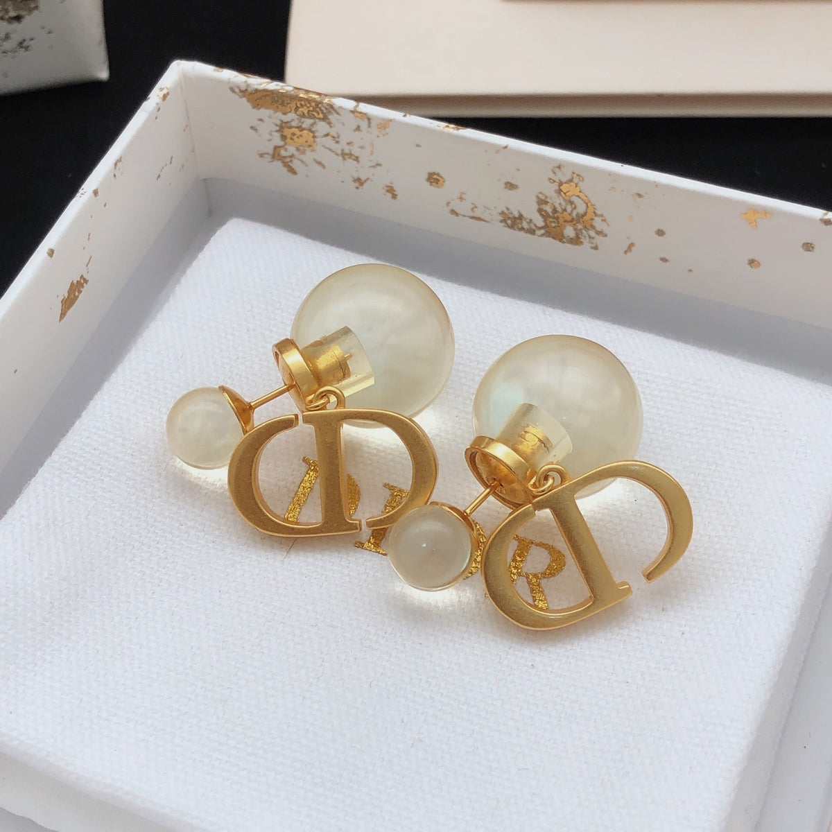 Martin Graham stud earrings in polished metal-tone – front view