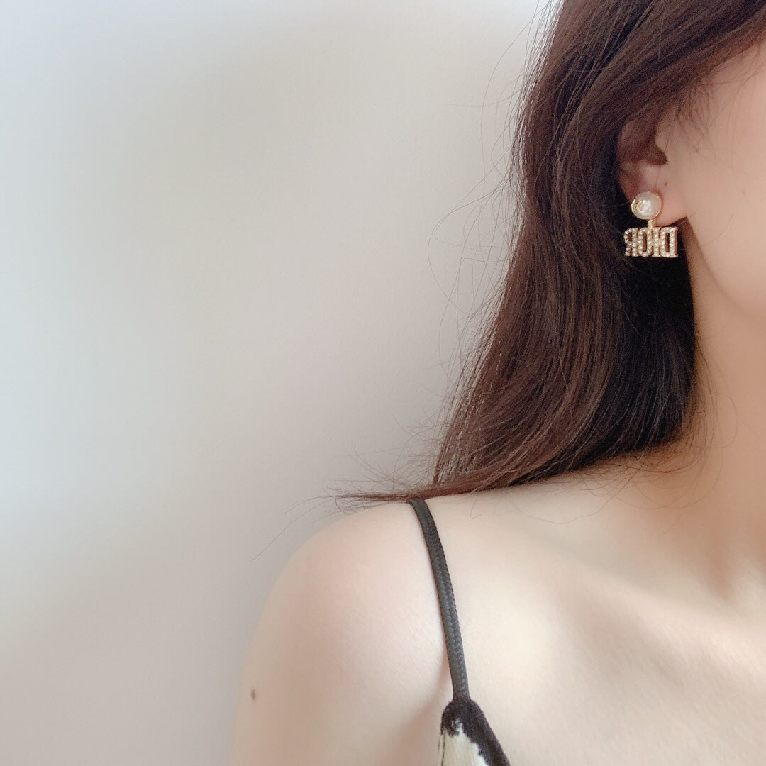 Martin Graham stud earrings in polished metal-tone – front view