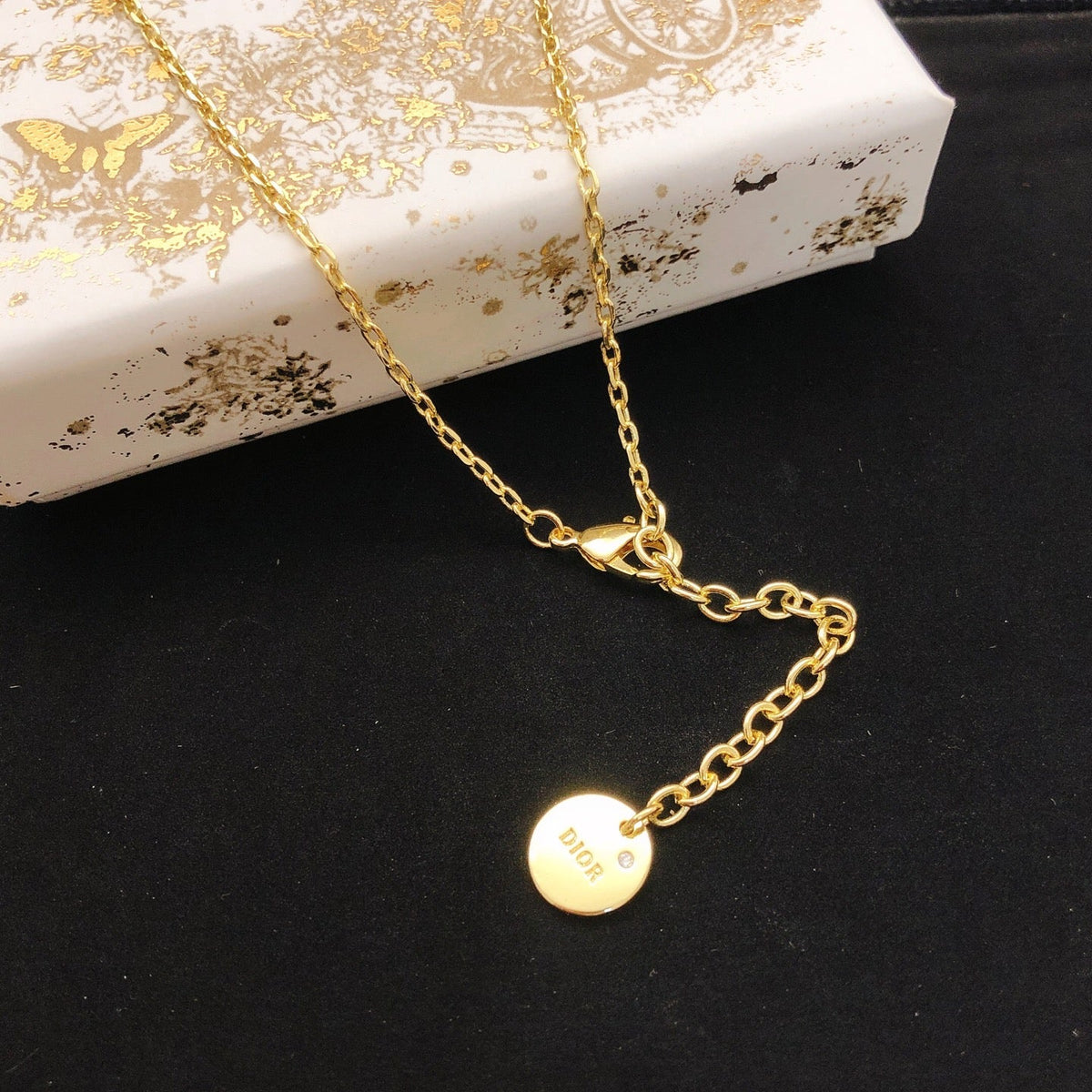 Martin Graham pendant necklace in polished metal-tone – front view
