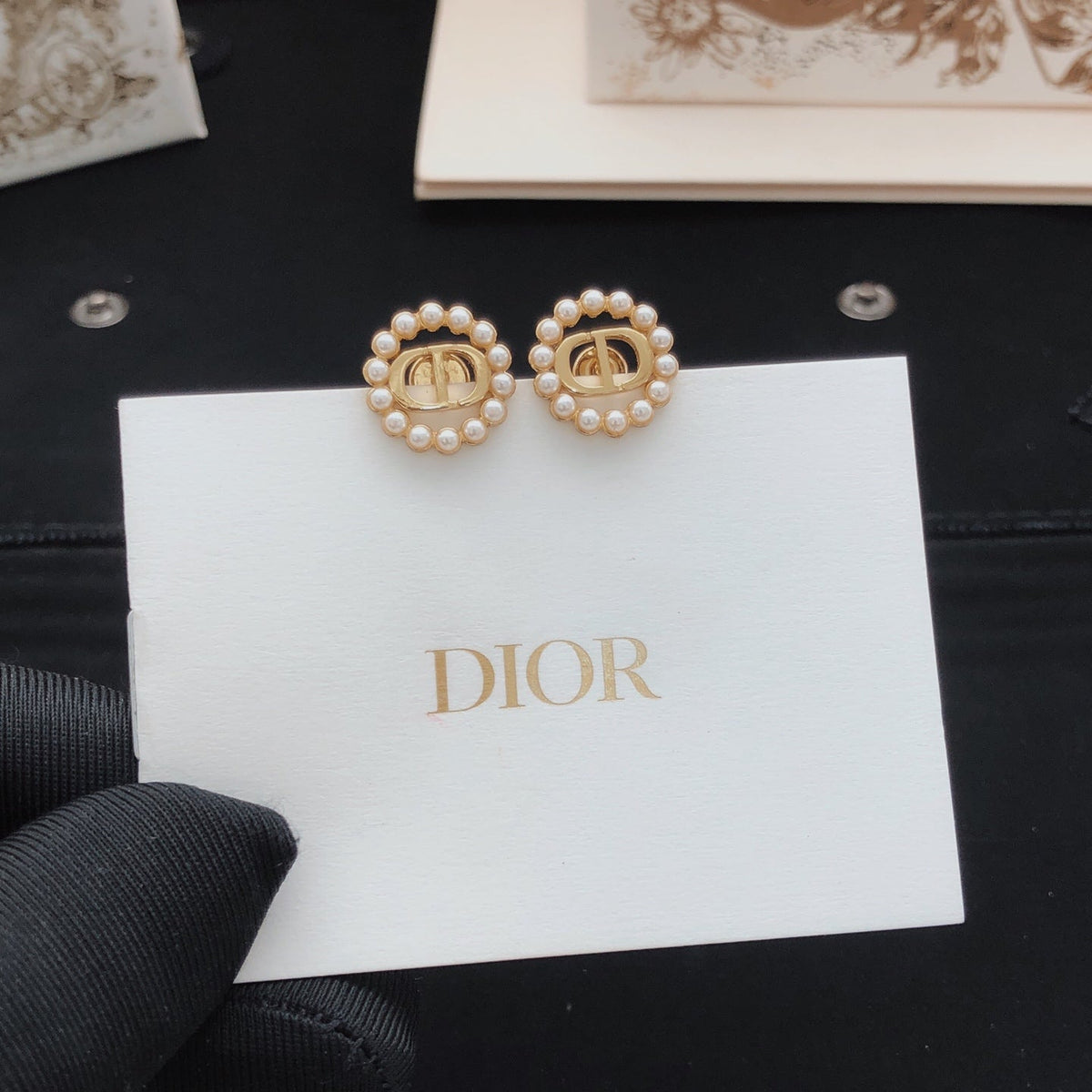 Martin Graham stud earrings in polished metal-tone – front view