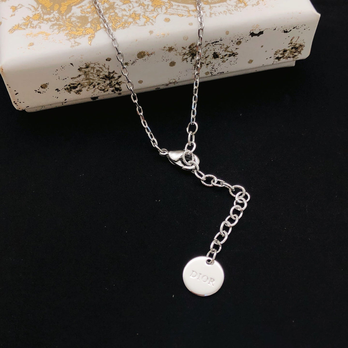 Martin Graham pendant necklace in polished metal-tone – front view