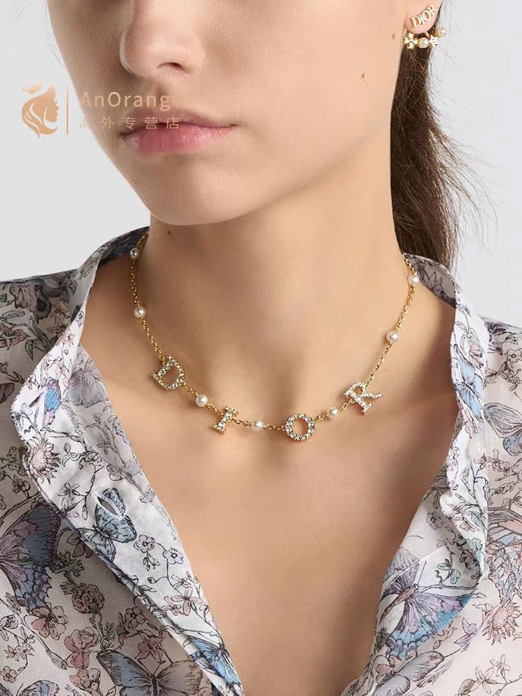 Martin Graham pendant necklace in polished metal-tone – front view