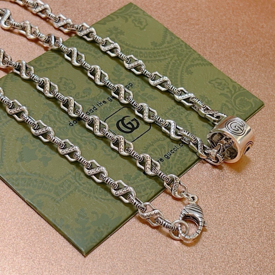 Martin Graham pendant necklace in polished metal-tone – front product view