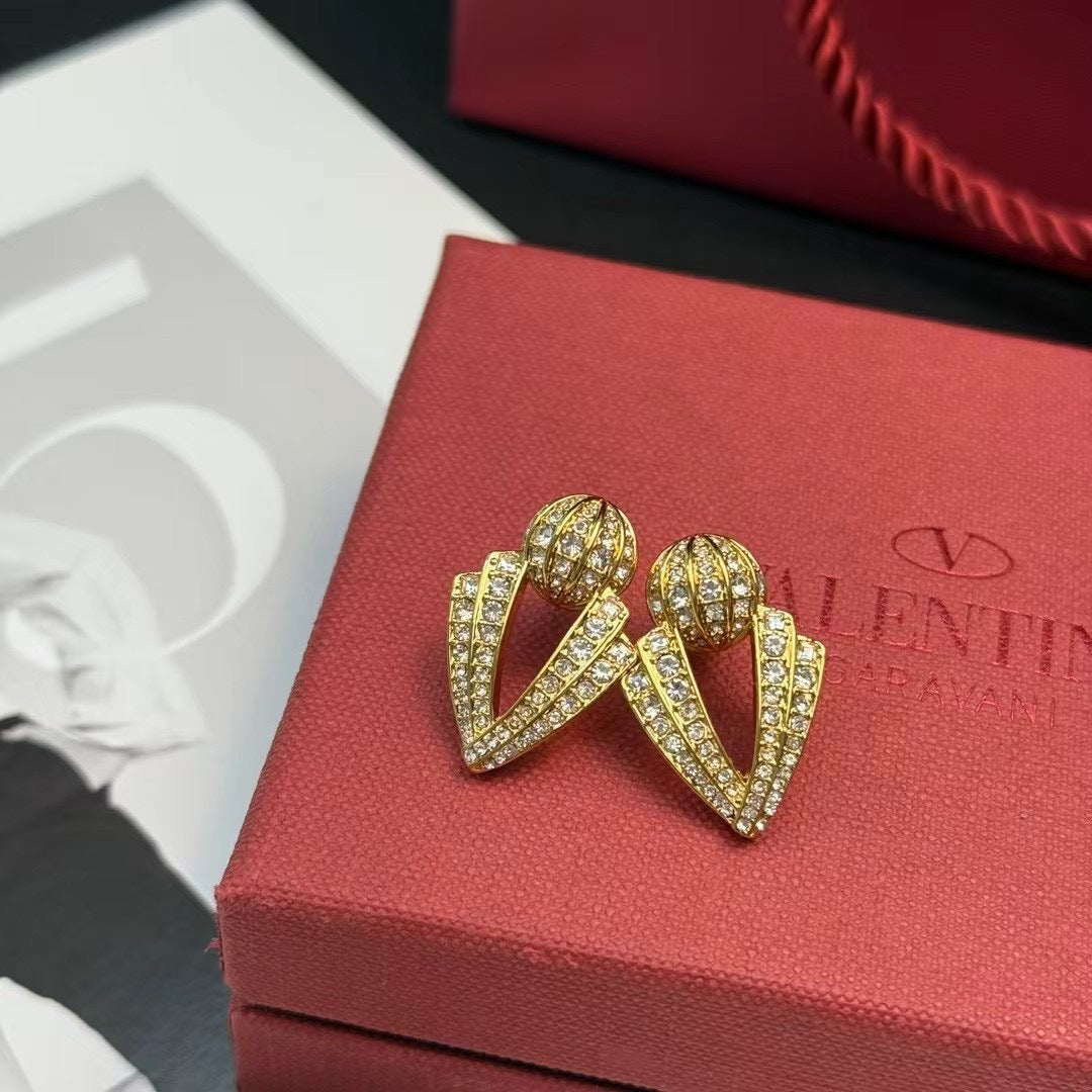Martin Graham stud earrings in polished metal-tone – front view
