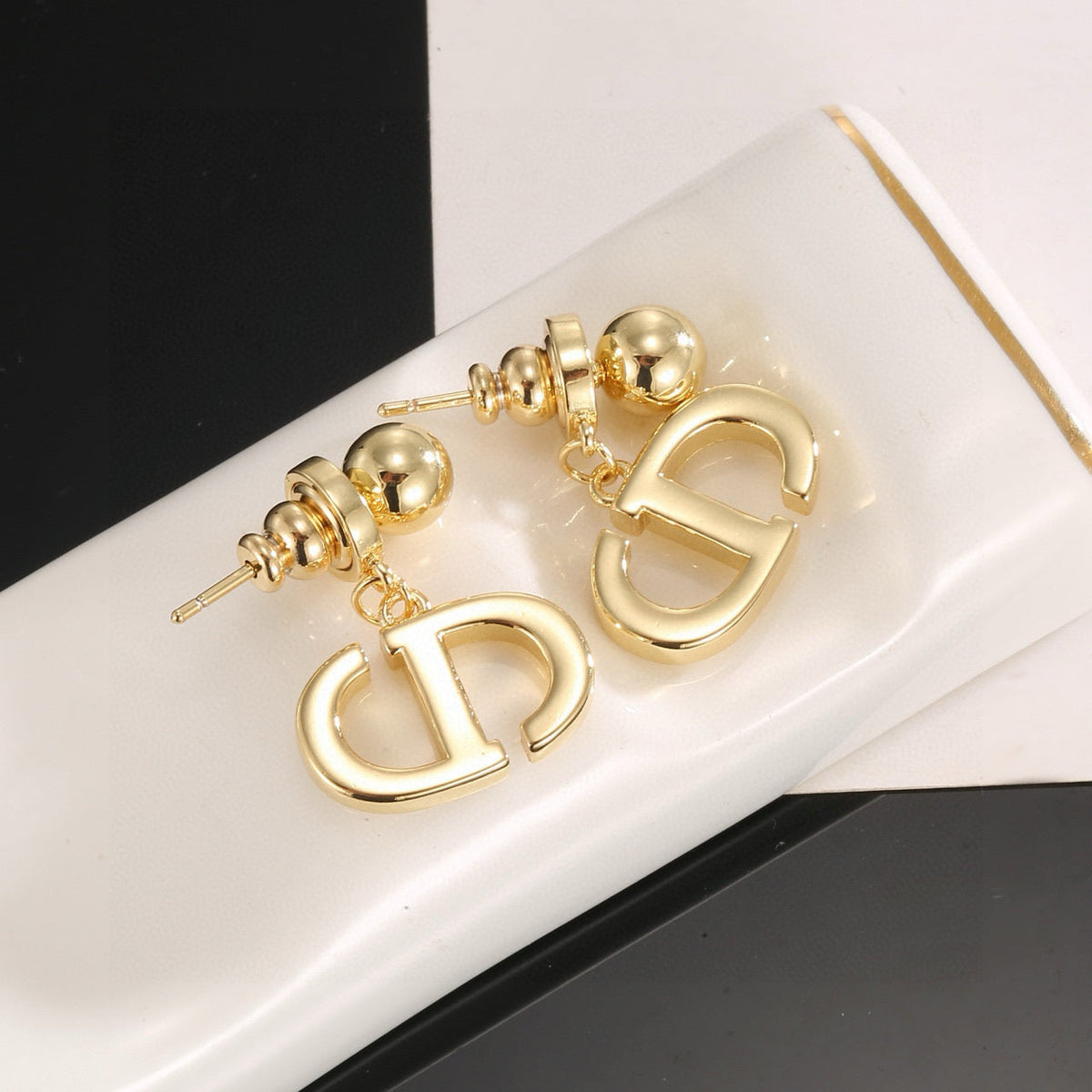 Martin Graham stud earrings in polished metal-tone – front view
