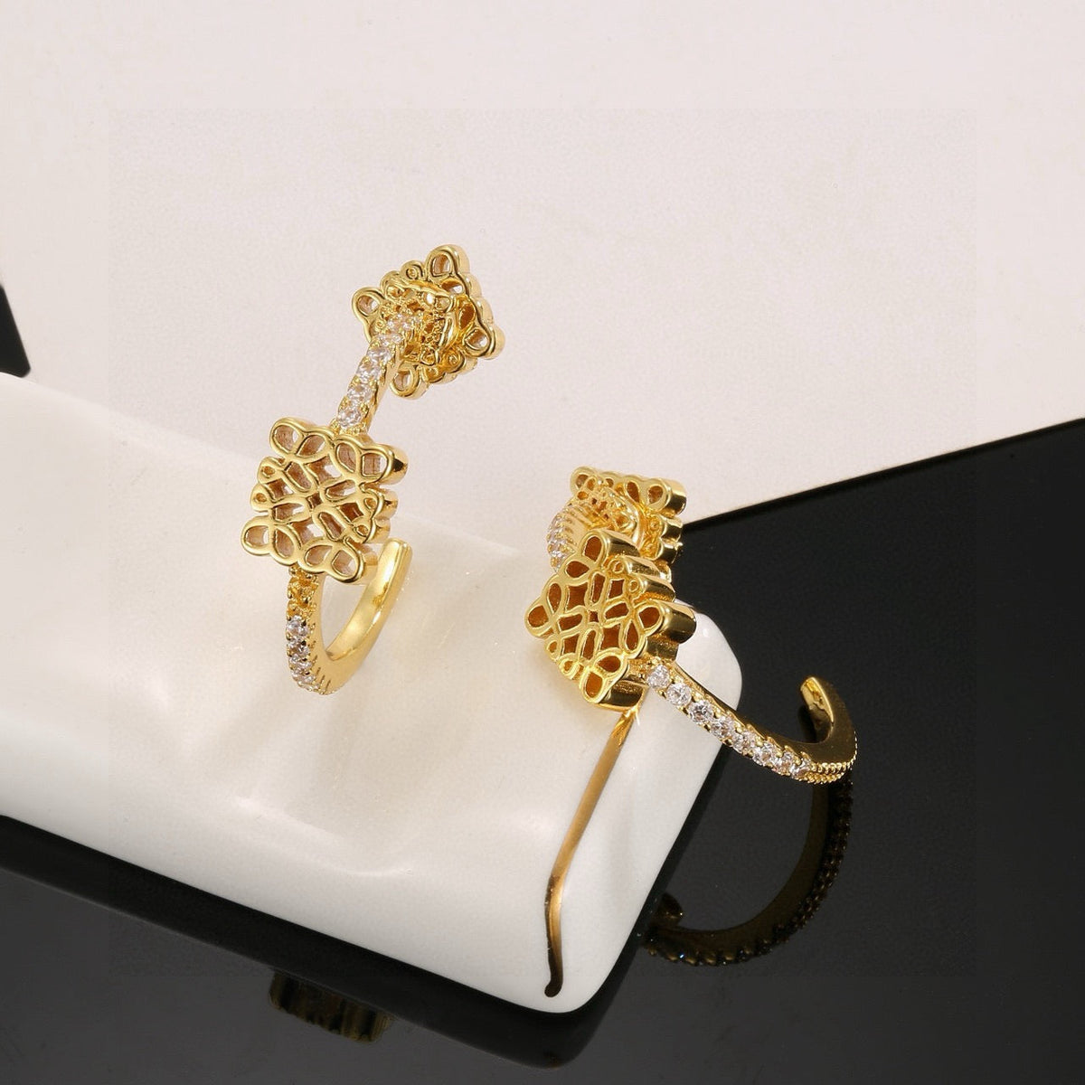 Martin Graham stud earrings in polished metal-tone – front view