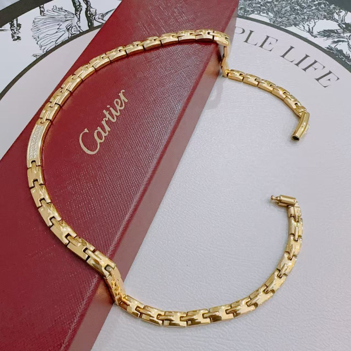 Martin Graham pendant necklace in polished metal-tone – front view
