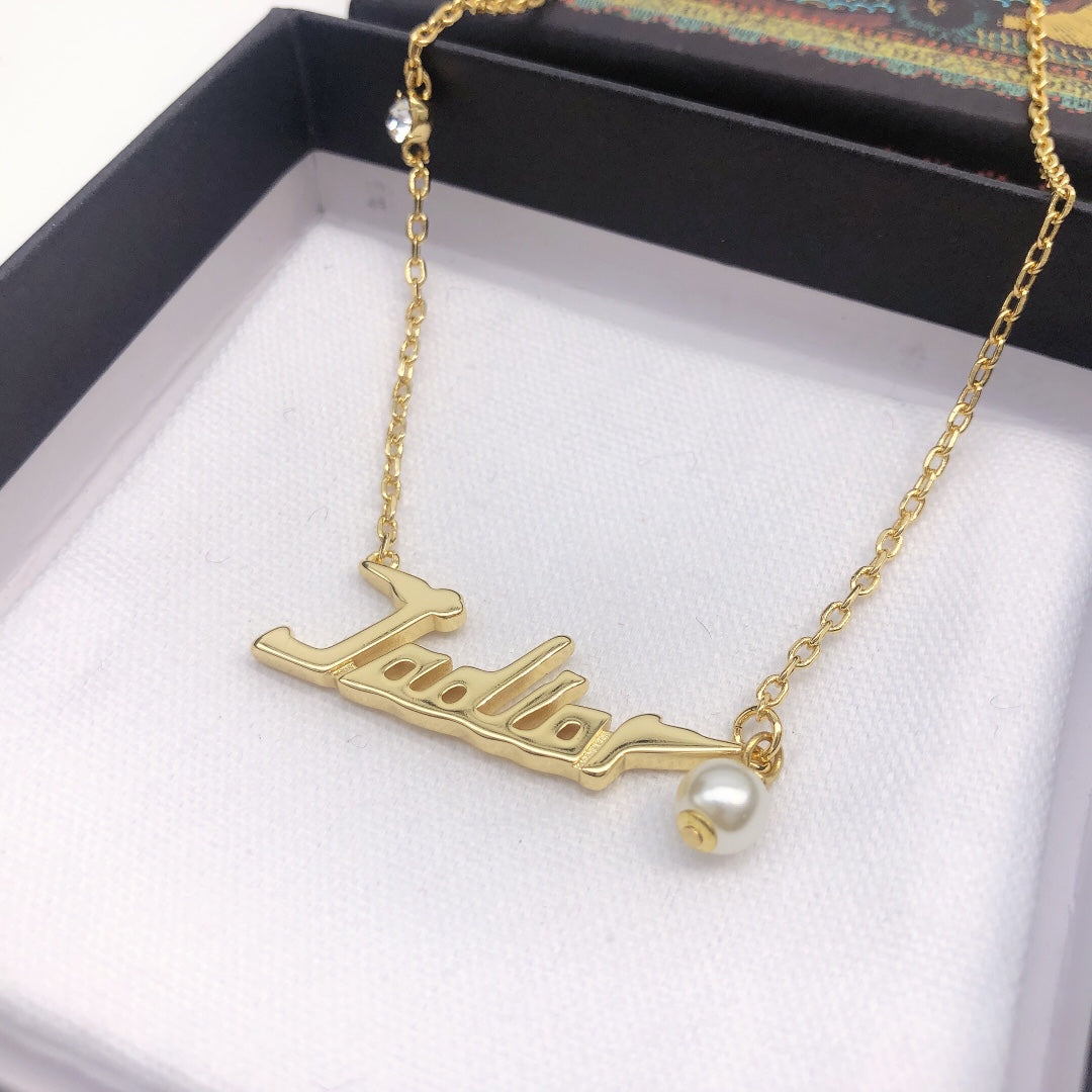 Martin Graham pendant necklace in polished metal-tone – front view