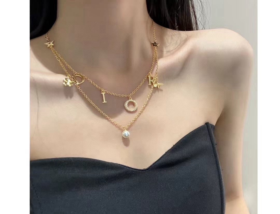 Martin Graham pendant necklace in polished metal-tone – front view