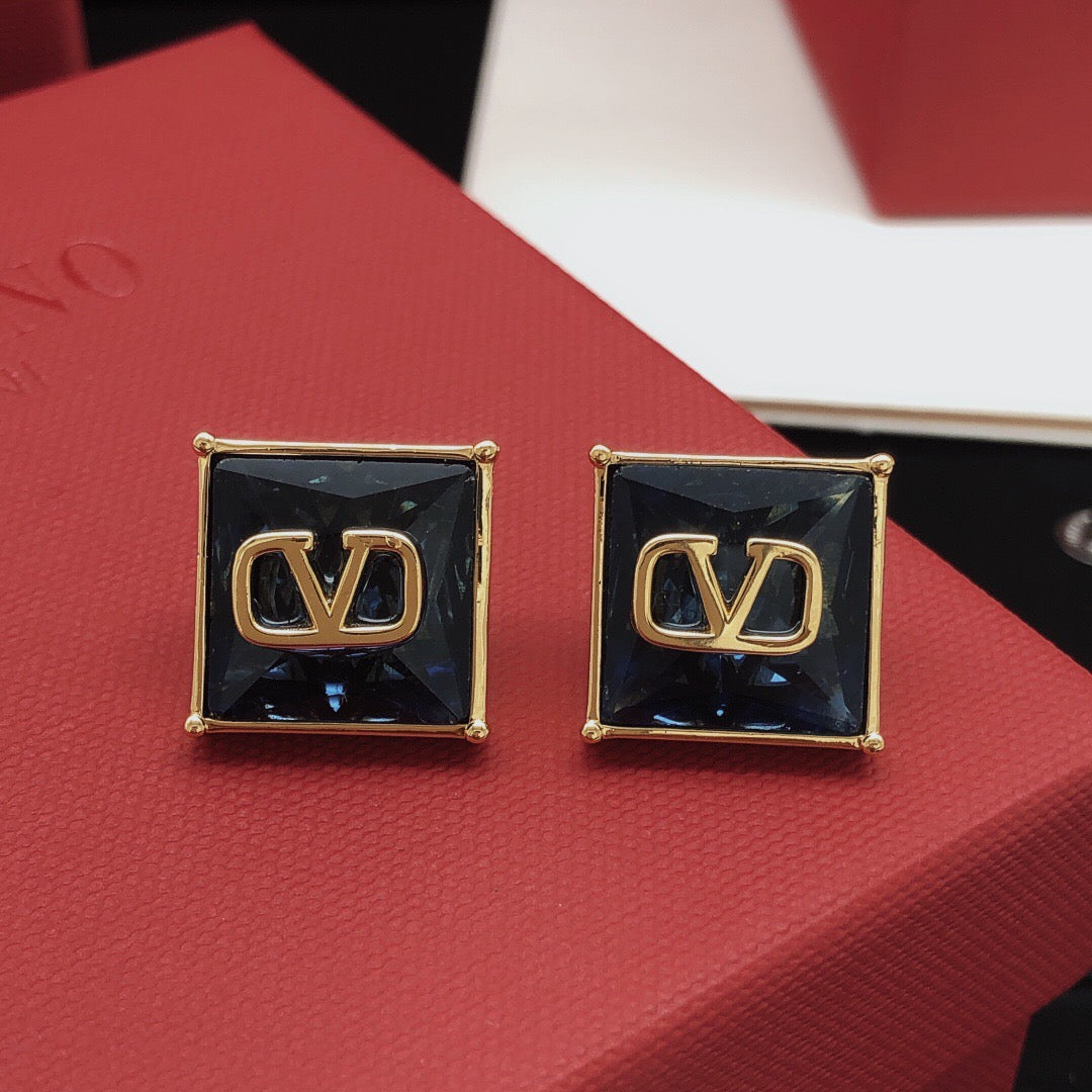 Martin Graham stud earrings in polished metal-tone – front view