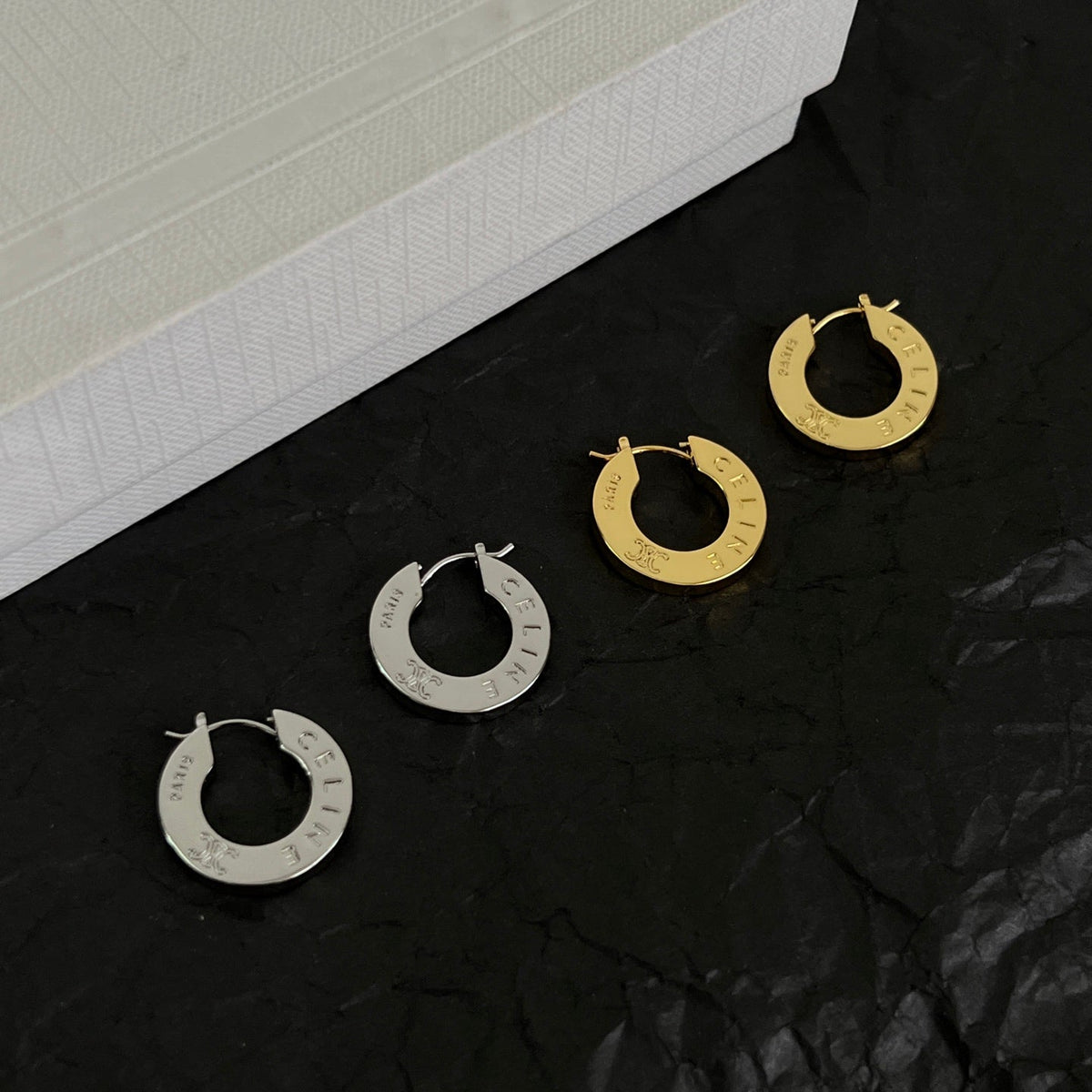 Martin Graham earrings in polished metal-tone – front view