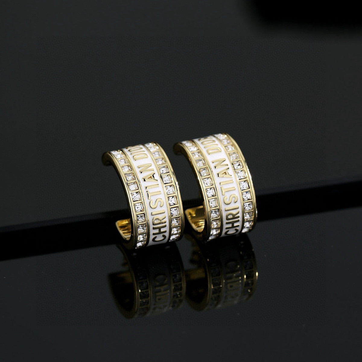 Martin Graham earrings in polished metal-tone – front view