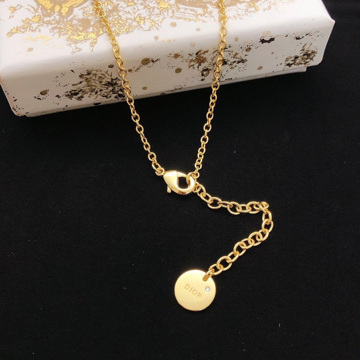 Martin Graham pendant necklace in polished metal-tone – front view