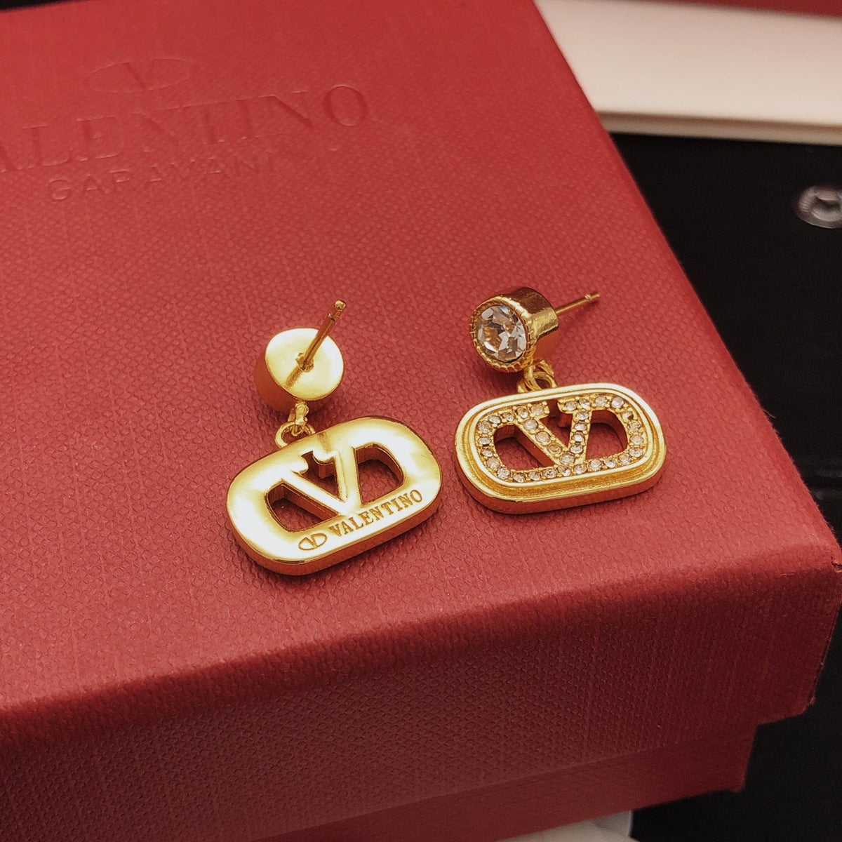 Martin Graham stud earrings in polished metal-tone – detail view