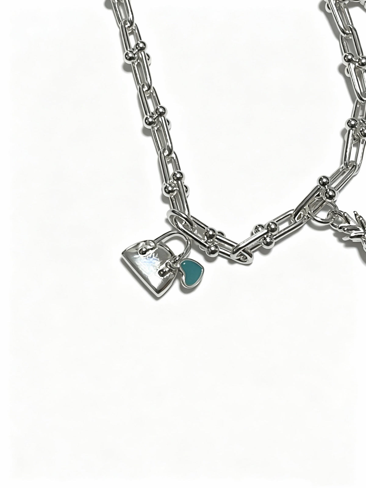 Martin Graham pendant necklace in polished metal-tone – detail view