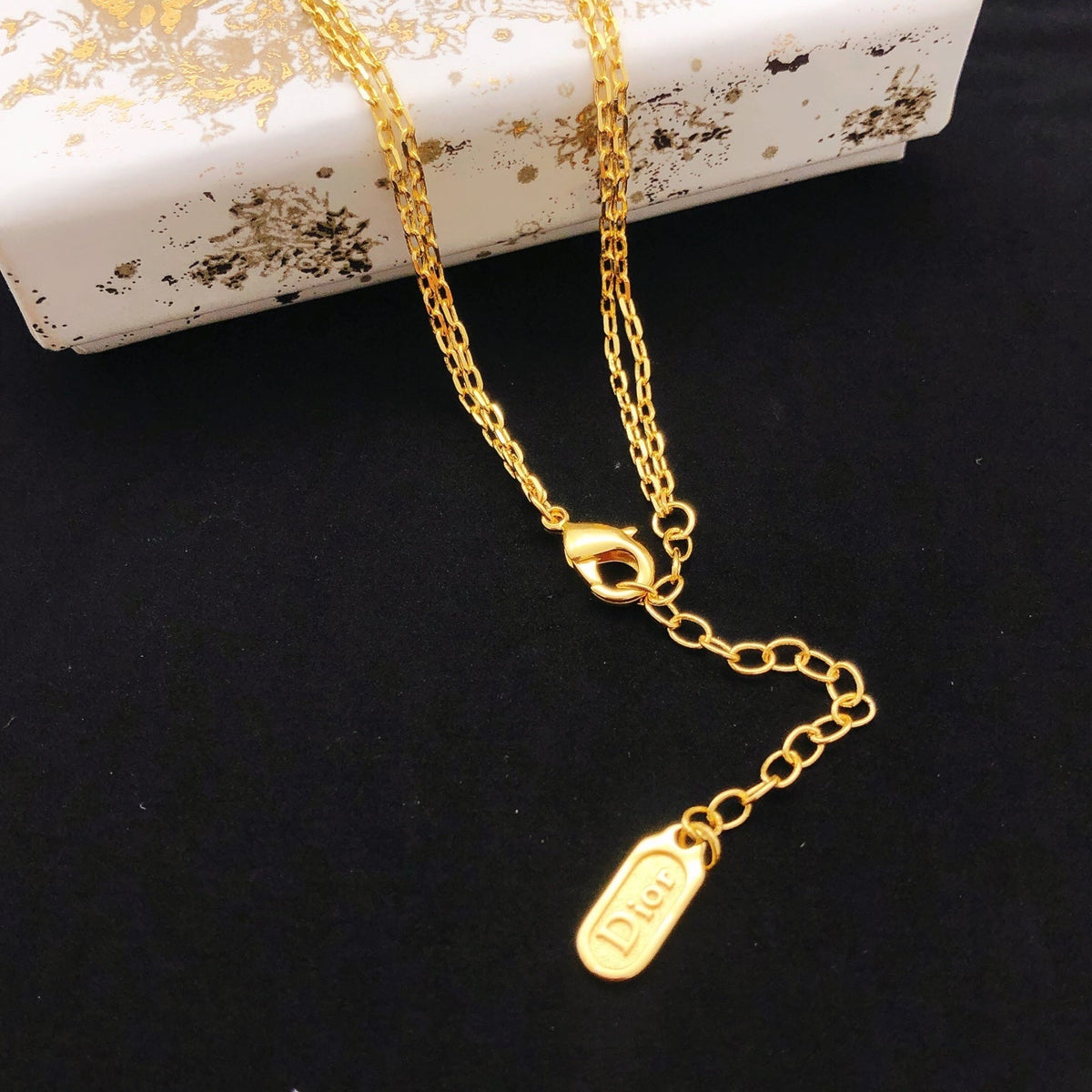Martin Graham pendant necklace in polished metal-tone – detail view