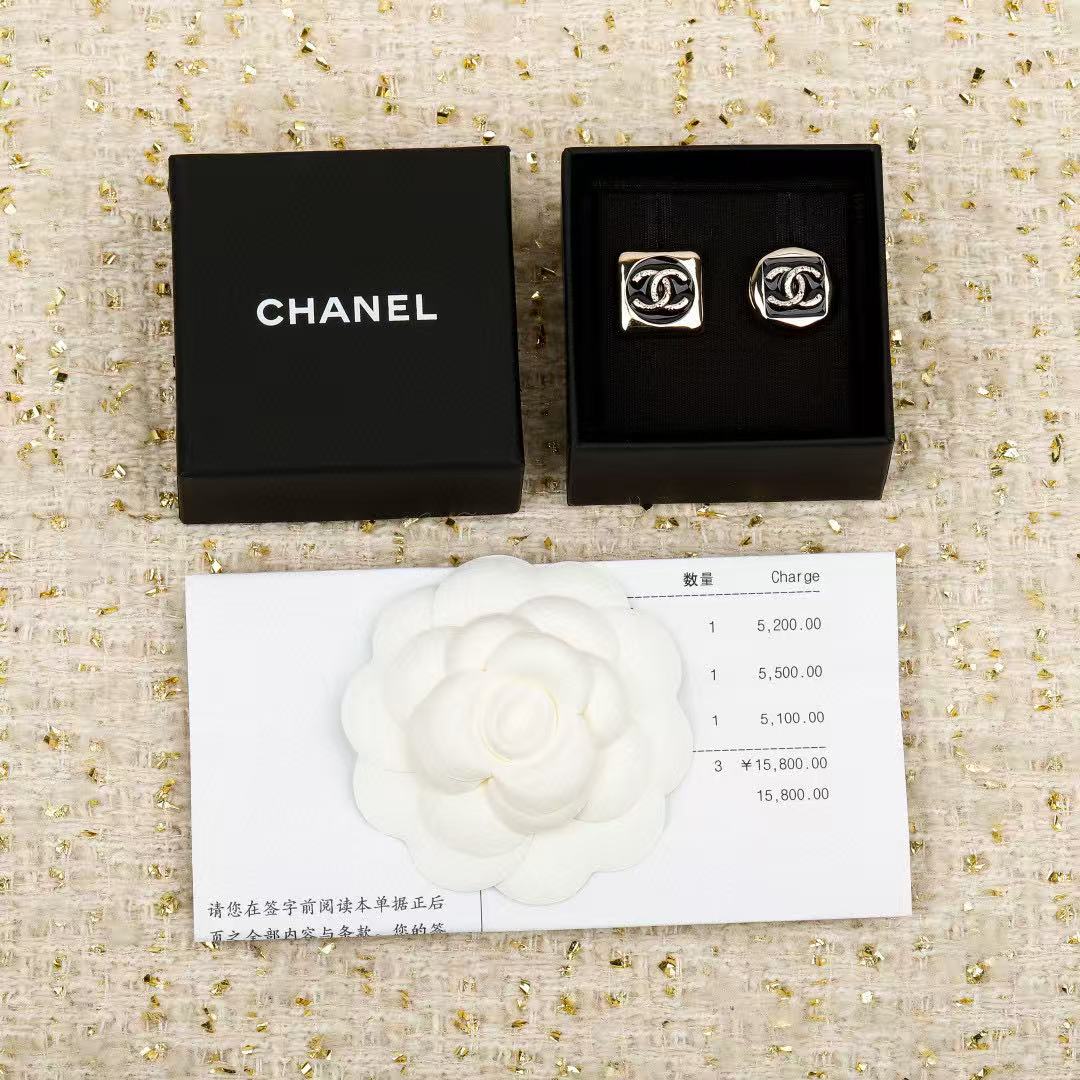 Martin Graham stud earrings in polished metal-tone – detail view