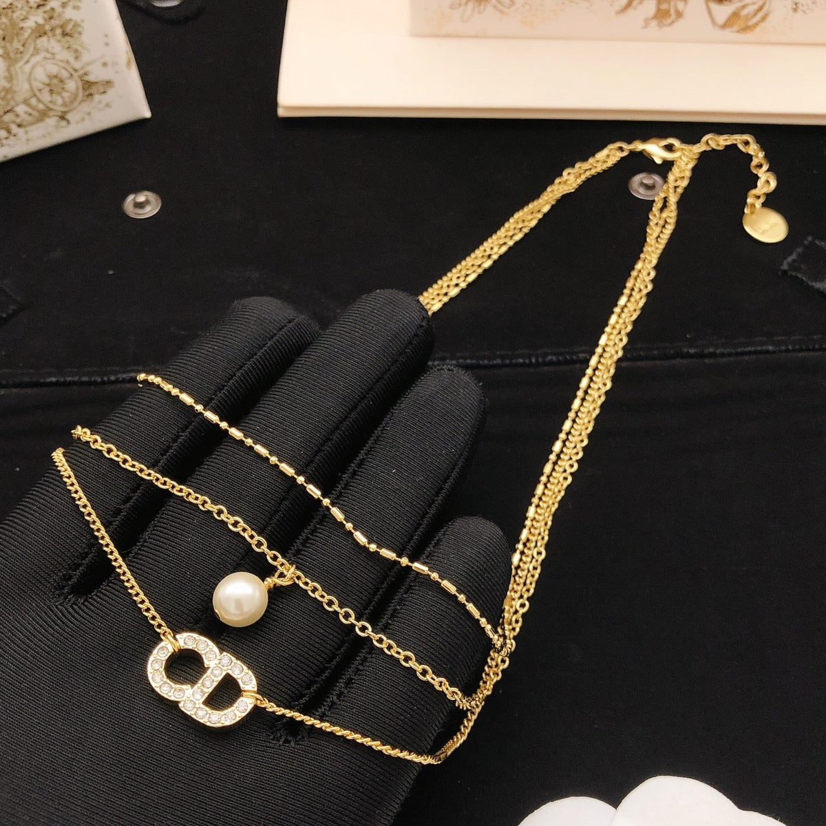 Martin Graham pendant necklace in polished metal-tone – detail view