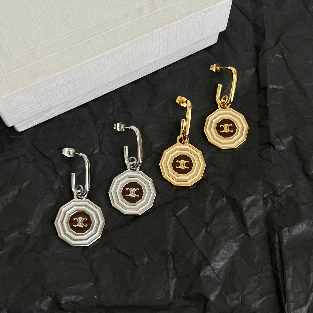 Martin Graham stud earrings in polished metal-tone – detail view