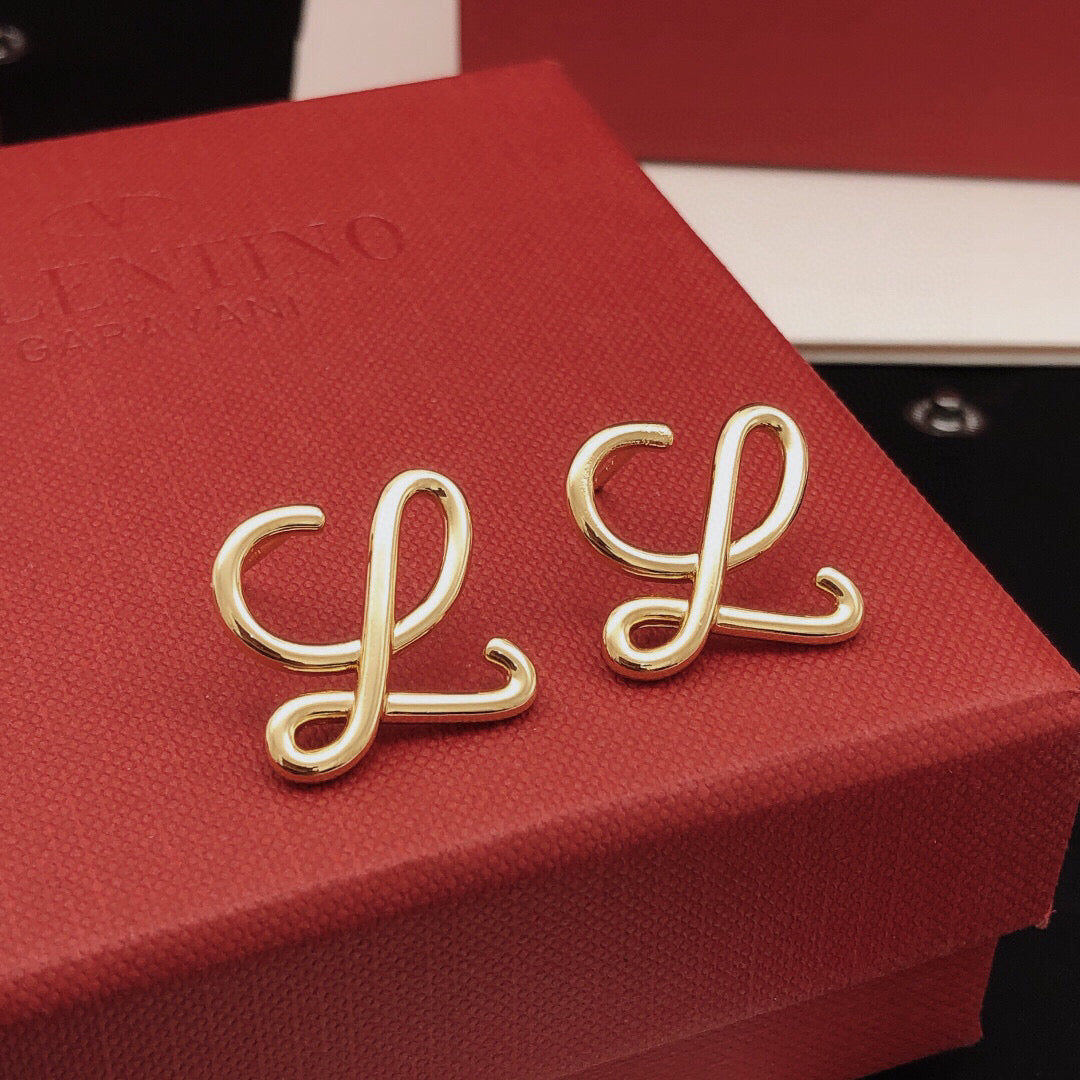 Martin Graham stud earrings in polished metal-tone – detail view