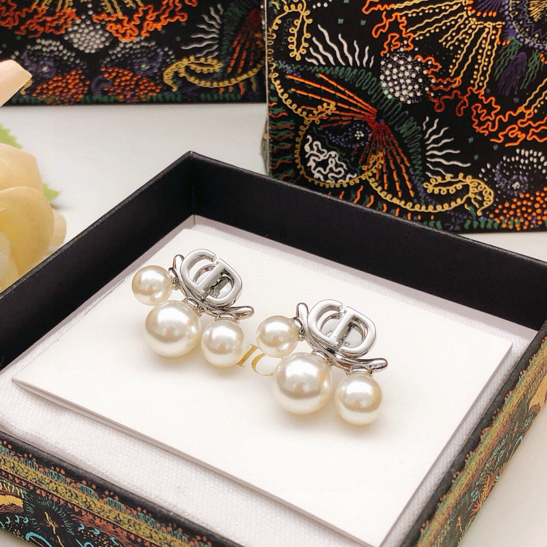 Martin Graham stud earrings in polished metal-tone – detail view