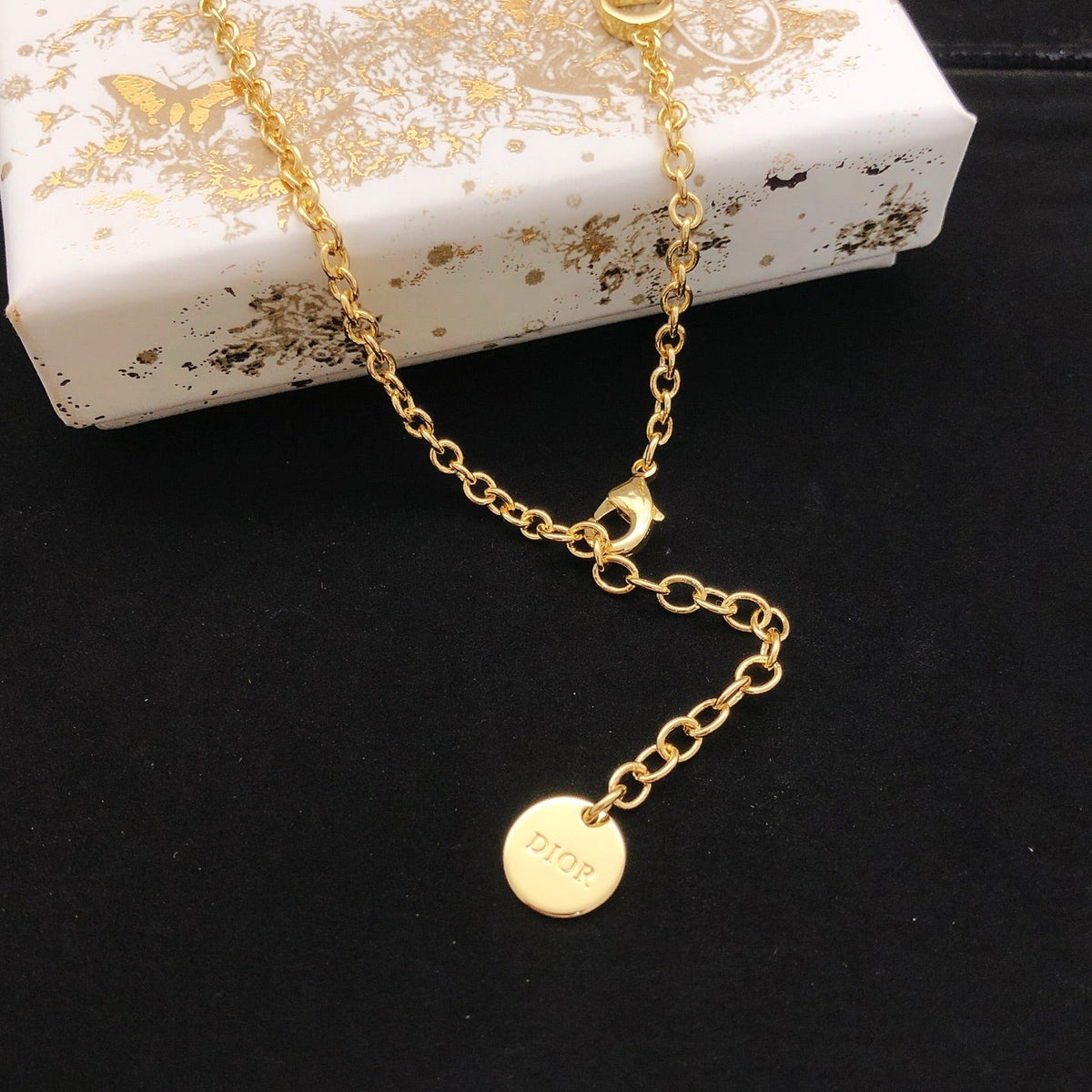 Martin Graham pendant necklace in polished metal-tone – detail view