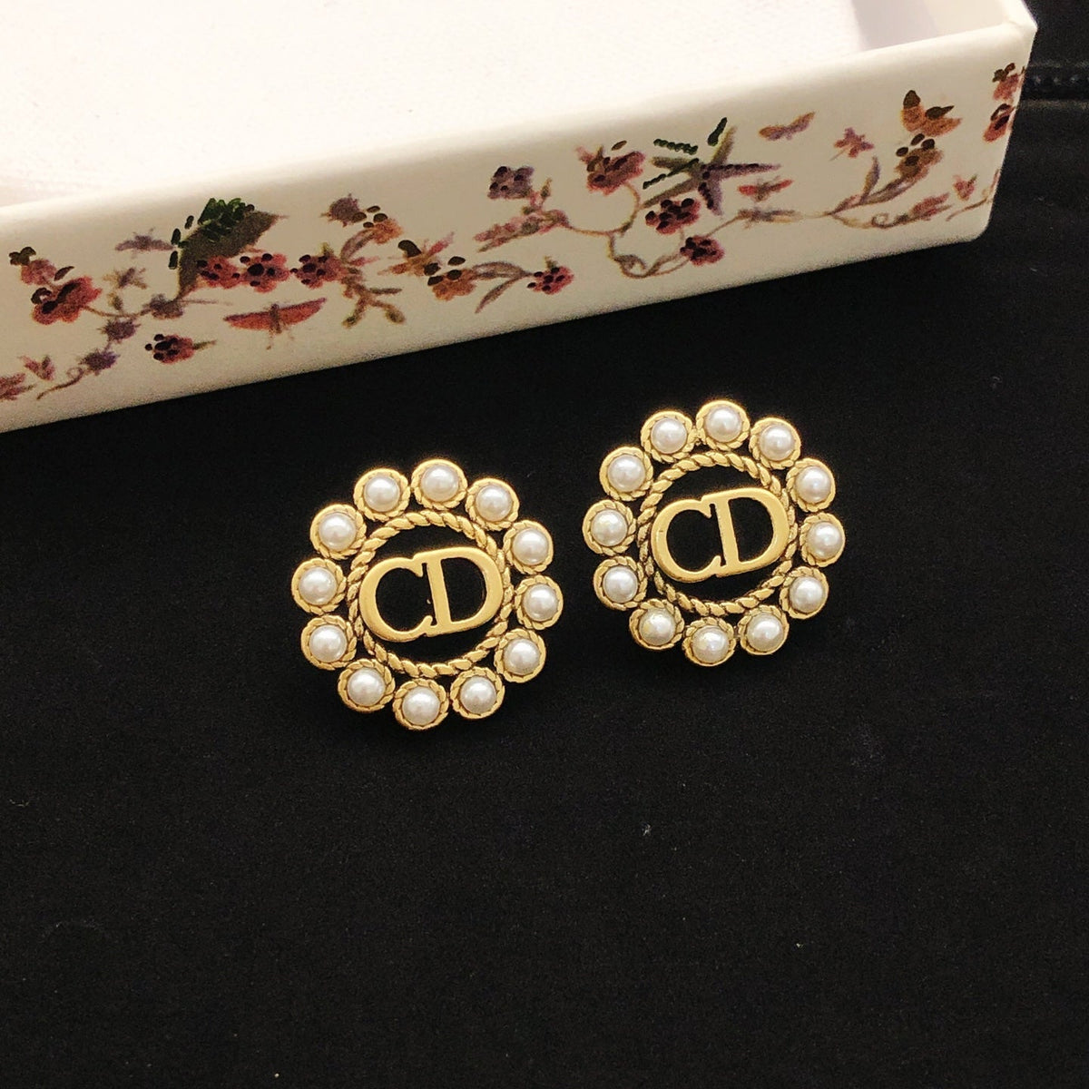 Martin Graham stud earrings in polished metal-tone – detail view